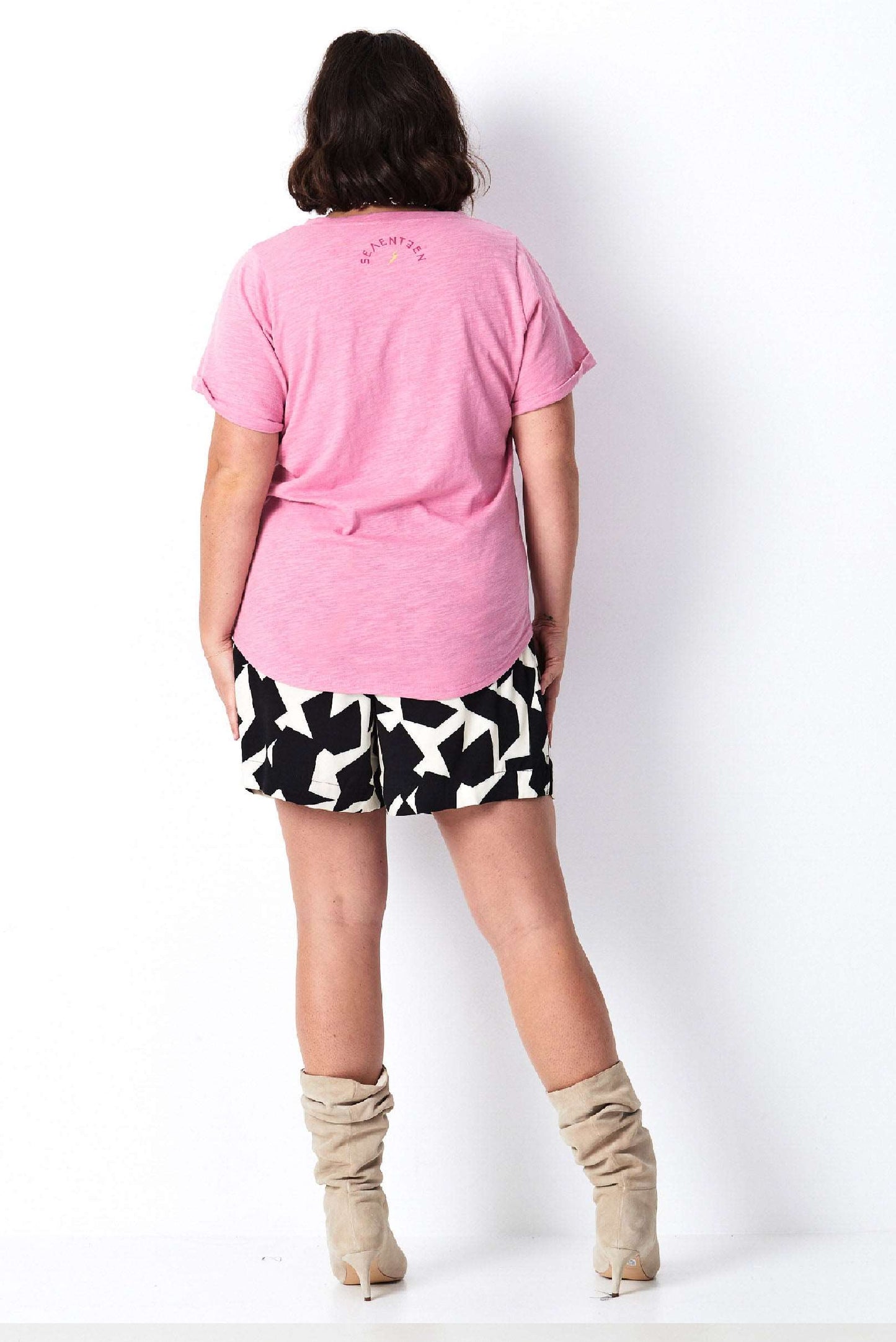 Model wears pink cotton plus size tee with print