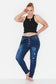 Model wears dark blue plus size tapered leg, ripped  jeans with exposed button front 