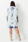 Model wears white and blue shibori tie dye plus size denim shirt dress 