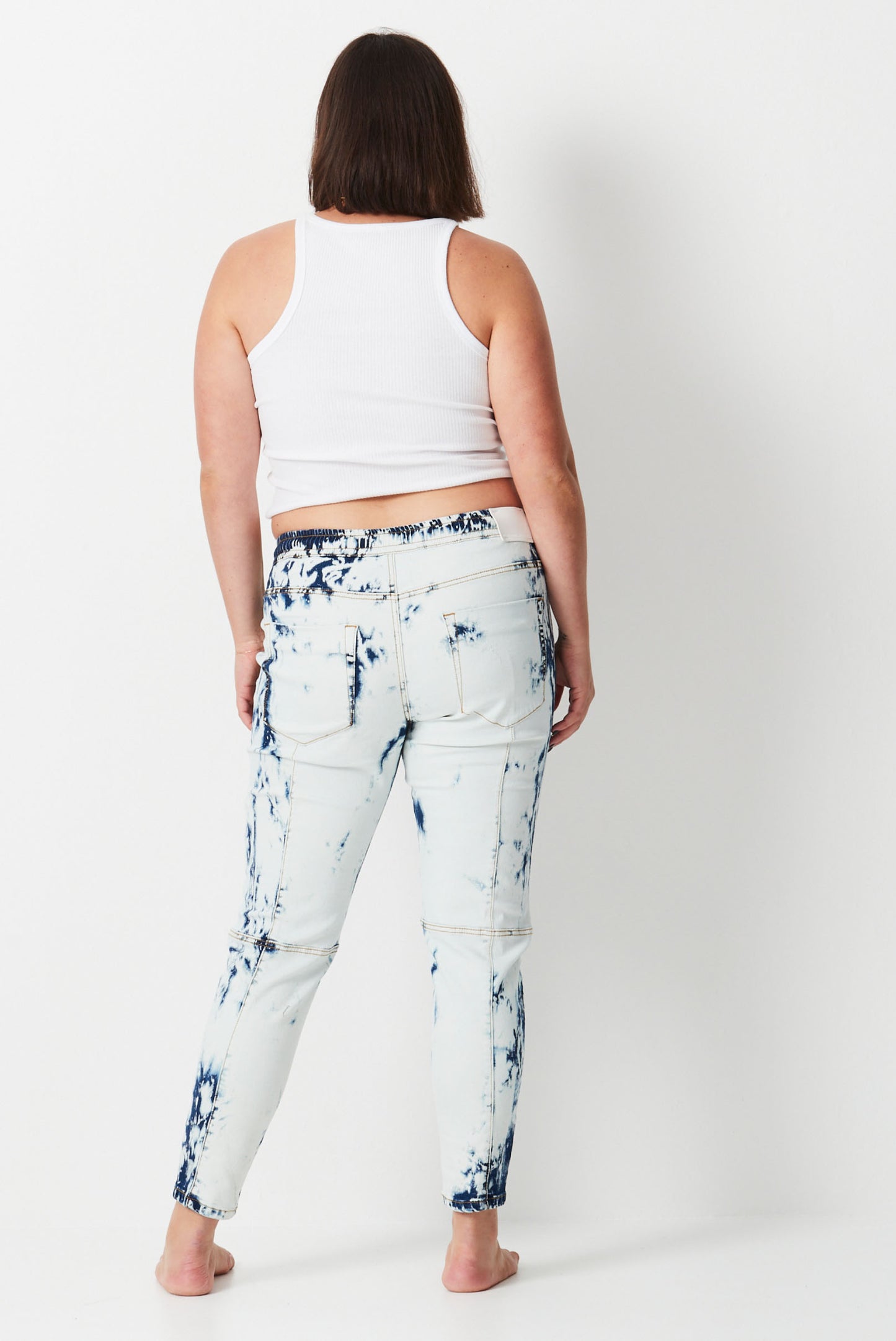 model wears white shibori denim jeans 