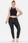 Model wears black plus size leather look slim leg plus size jeans 