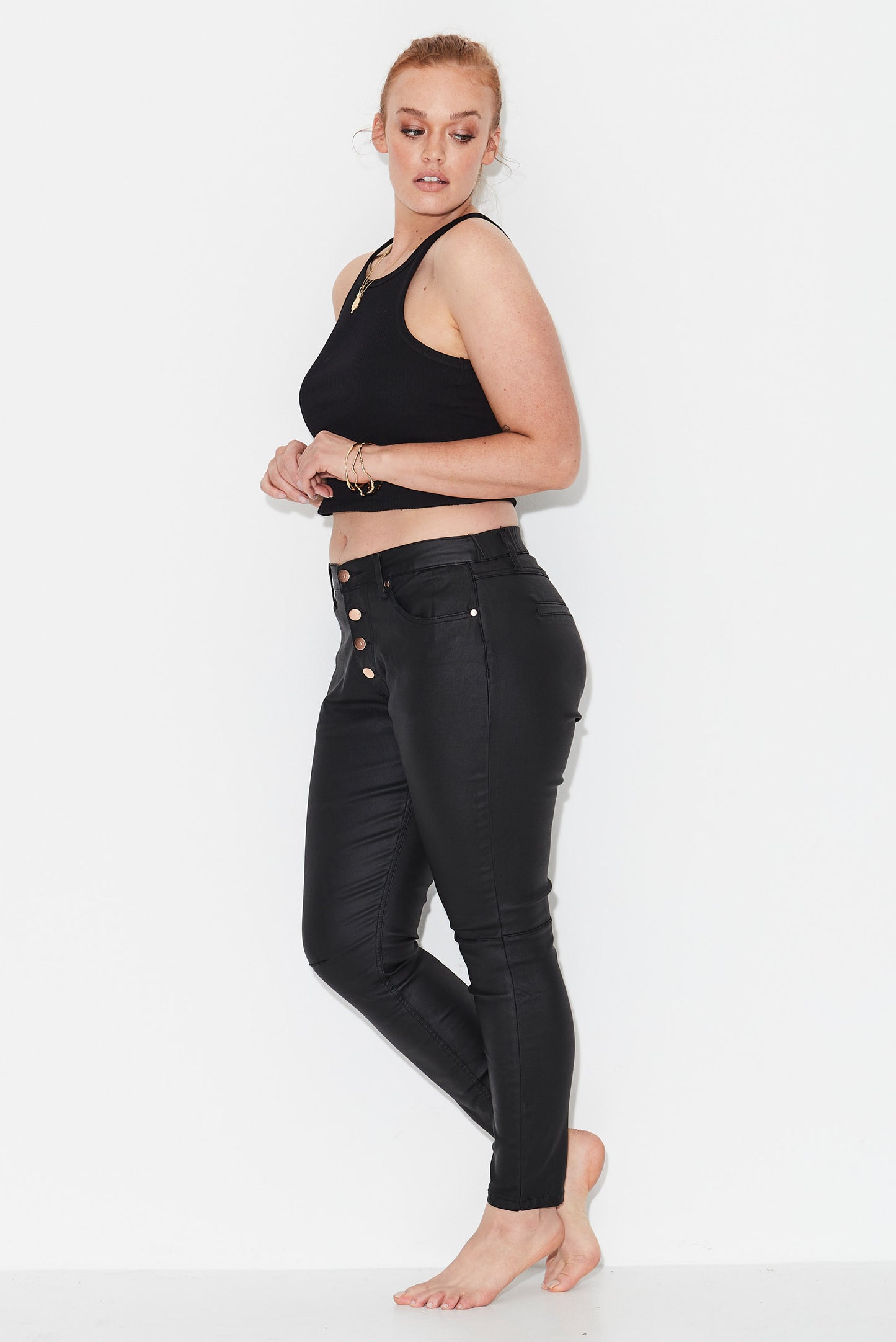 Model wears black size 14  jeans with exposed button front 
