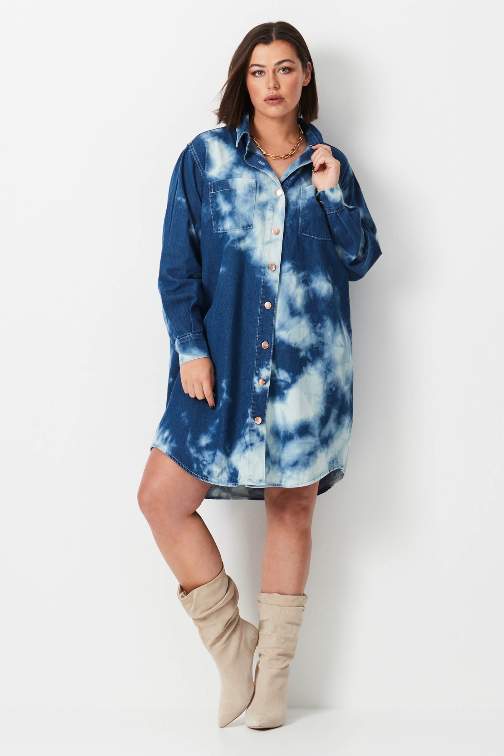 Model wears dark blue denim shibori plus size  shirt dress 